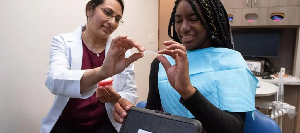 dentist showing patient invisalign in Lancaster tx